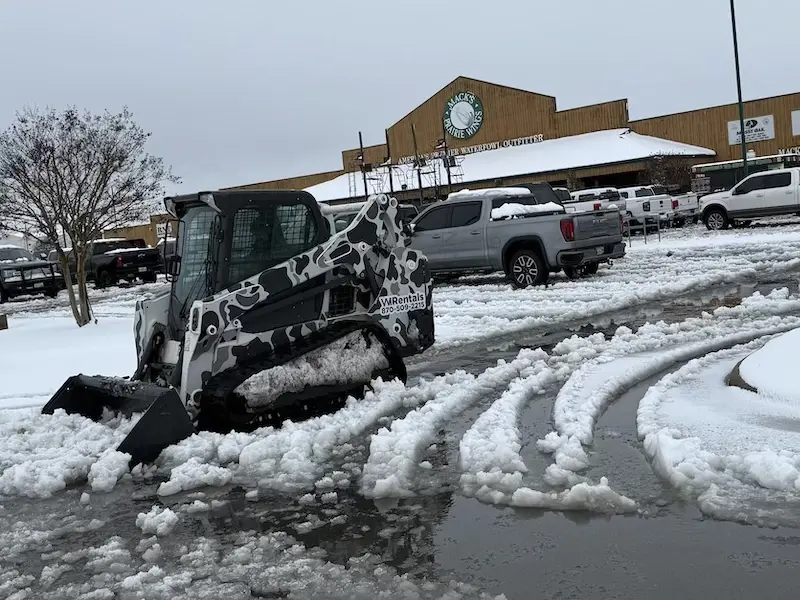 Snow removal service in Stuttgart, Arkansas WI Rentals skid steer providing snow removal service in Stuttgart, Arkansas